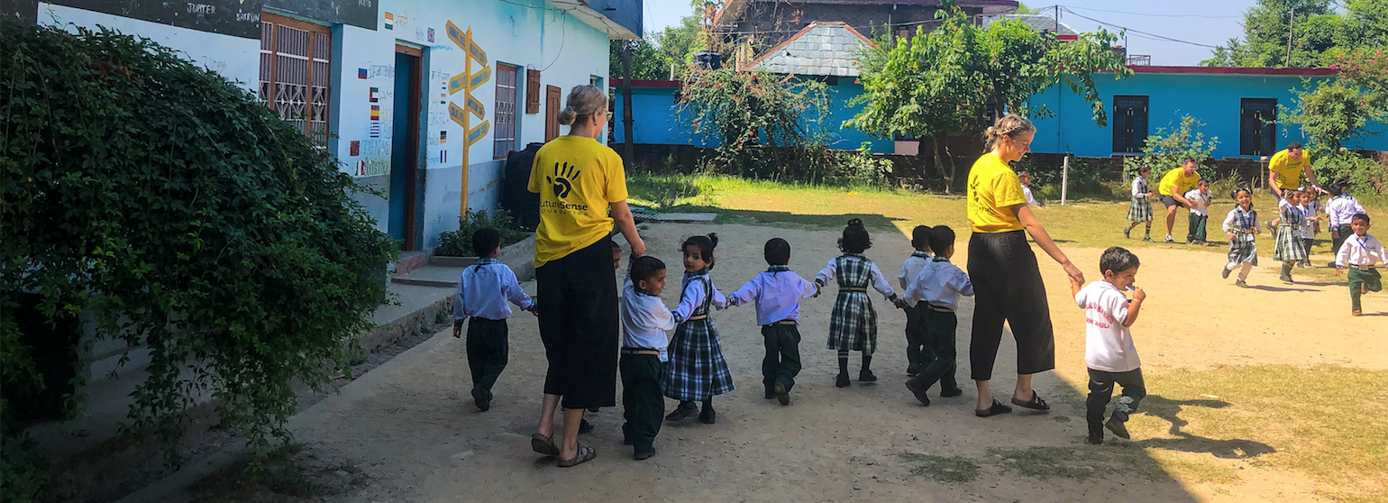 How our volunteers use music to help children learn English Banner